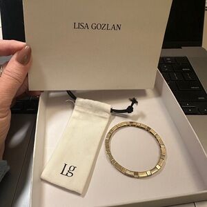 Lisa Gozlan  sleek refined design in iconic yellow gold plated 7”